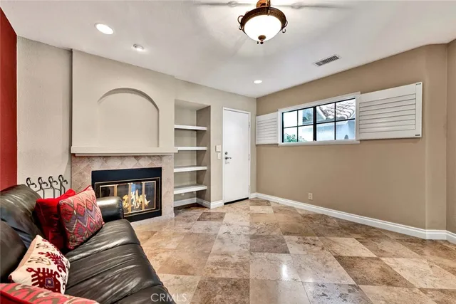 a bathroom with a granite countertop toilet sink and mirror