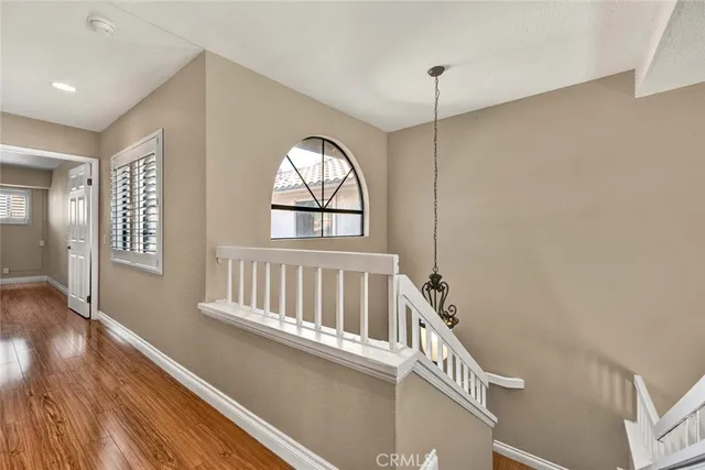 a view of an entryway with wooden floor