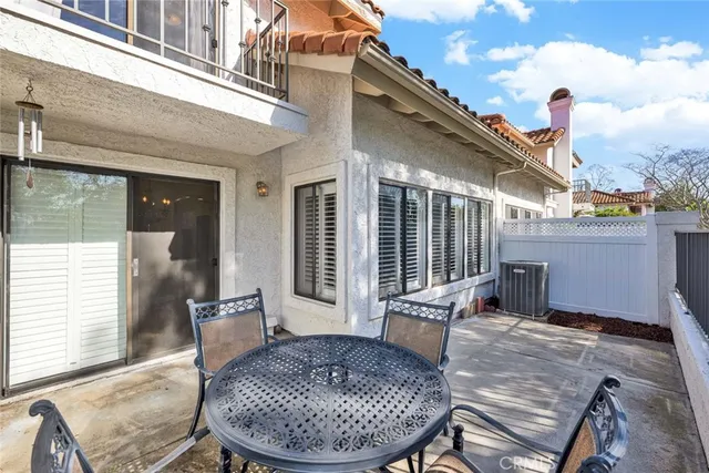 a front view of a house with garden and parking