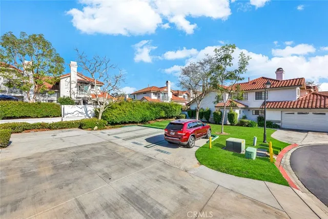 a front view of a house with a garden and patio