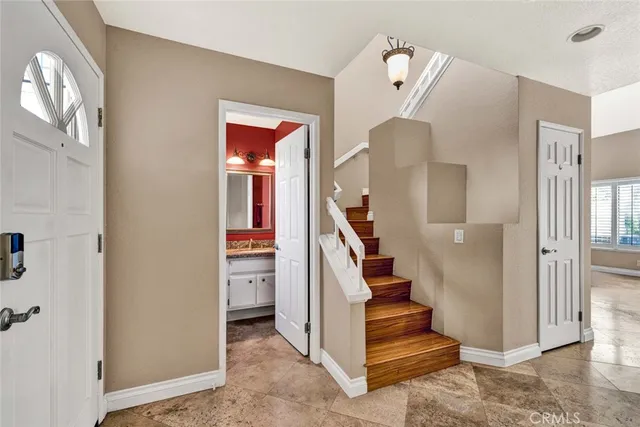 a view of entryway and hall with a front door