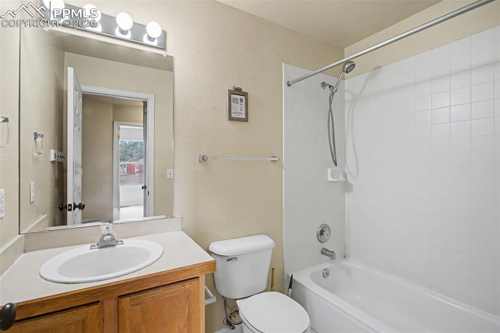 4944 Antelope Trail Elbert, CO 80106 - Photo 19 of 49 Bathroom featuring vanity and shower combination