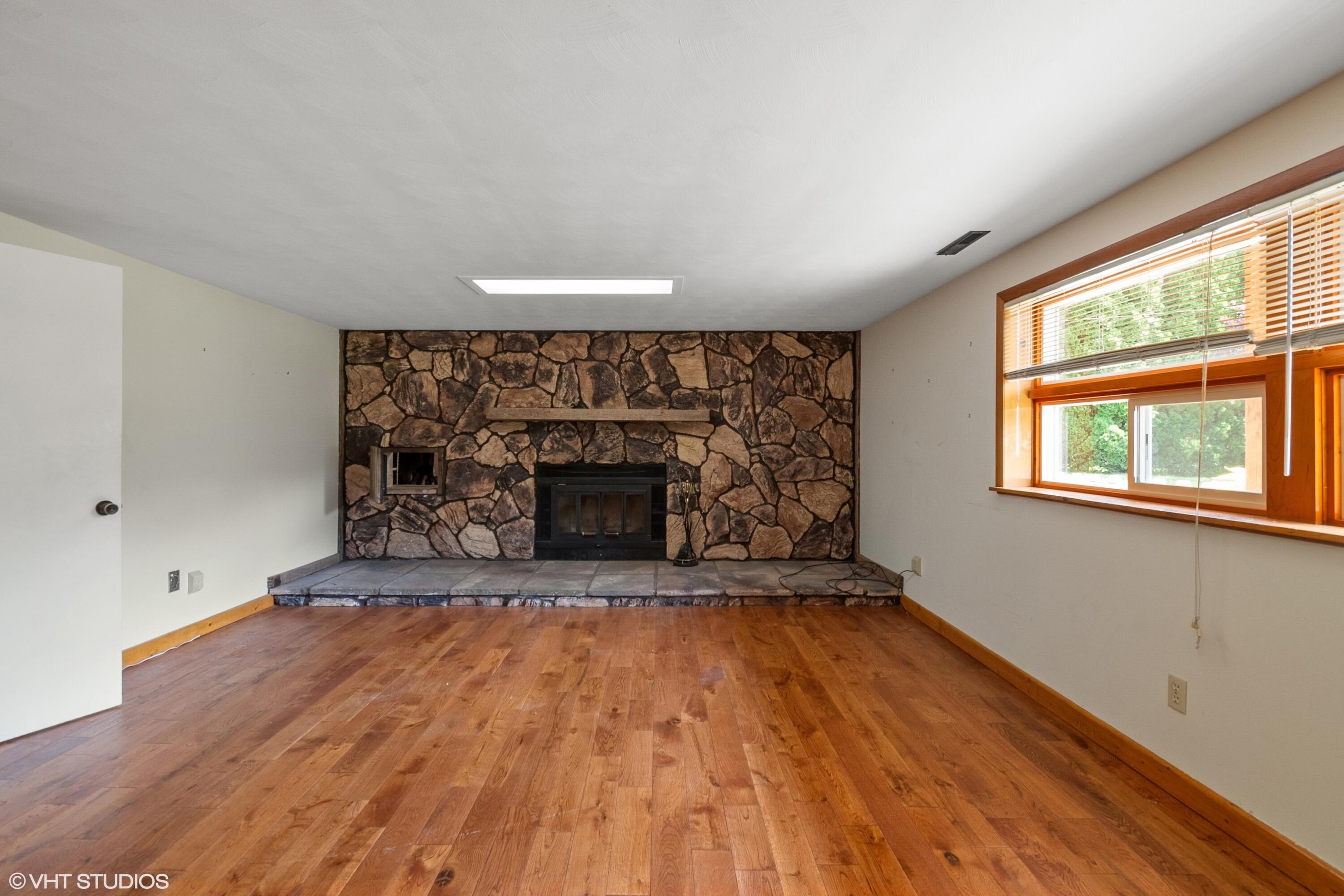 606 South 18th Street Chesterton, IN 46304 - Photo 12 of 24 an empty room with windows and fireplace