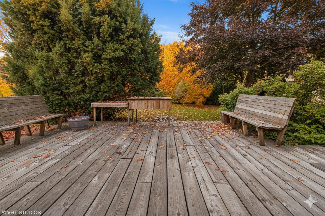 606 South 18th Street Chesterton, IN 46304 - Photo 21 of 24 a view of a wooden deck with a bench and trees