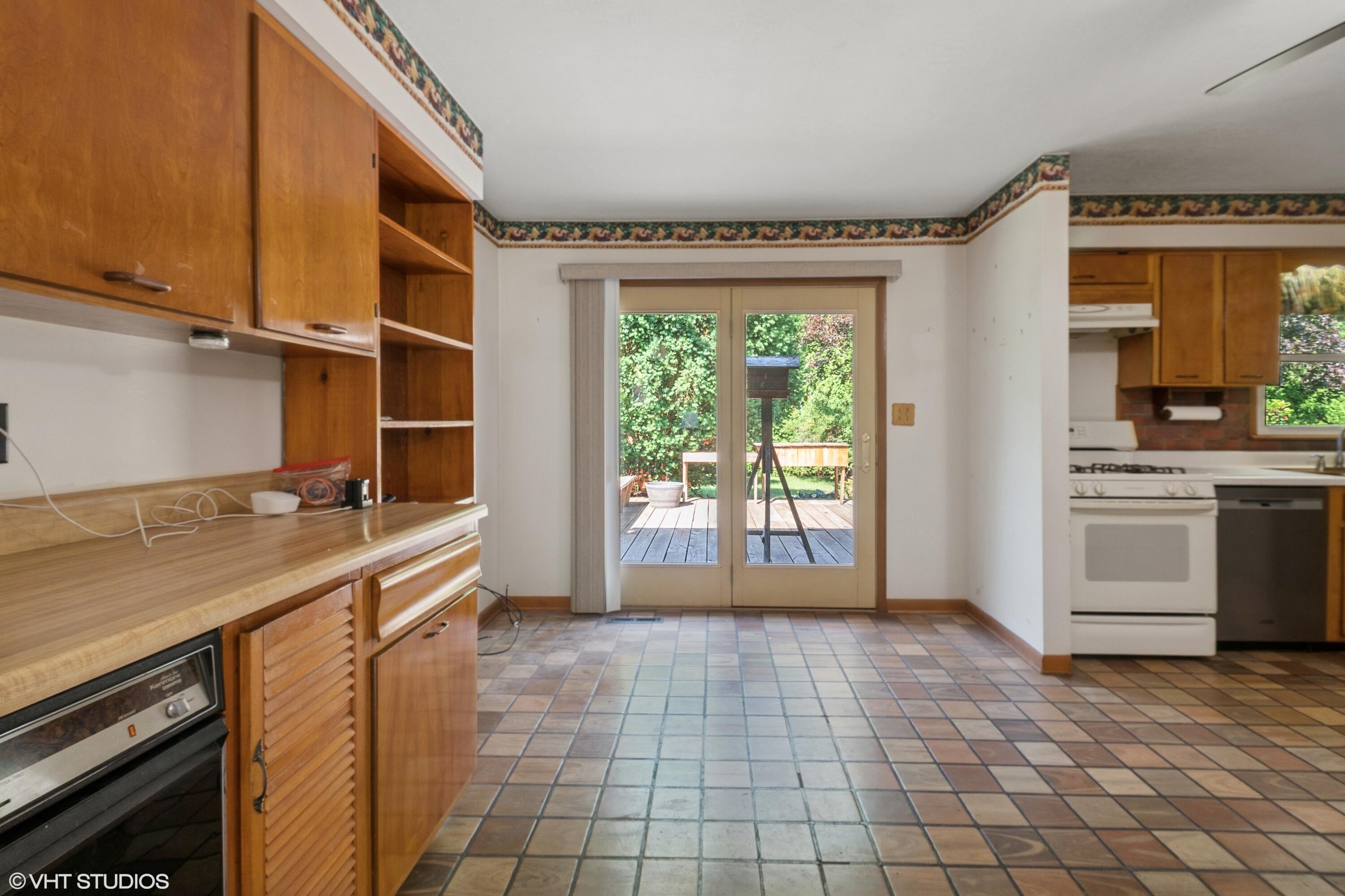 606 South 18th Street Chesterton, IN 46304 - Photo 5 of 24 a room with a sink and a stove top oven