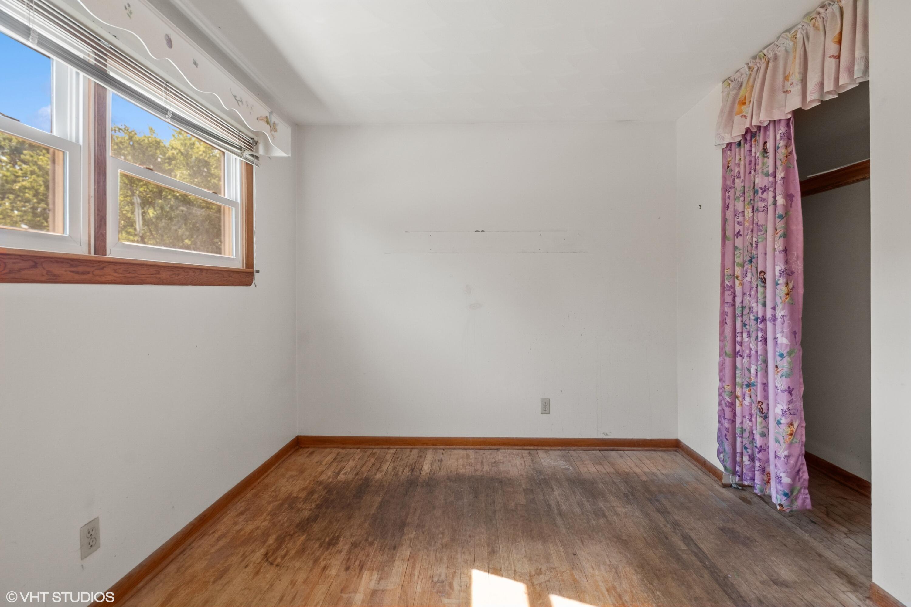 606 South 18th Street Chesterton, IN 46304 - Photo 9 of 24 a view of a room with wooden floor and windows