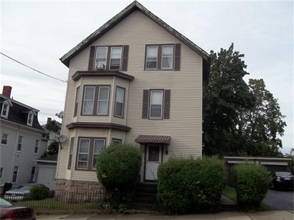 986 Middle Street Fall River, MA 02721 - Photo 1 of 11 a front view of a house with plants