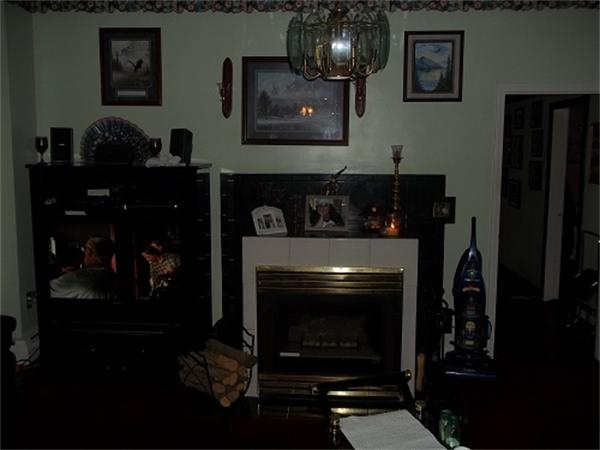 986 Middle Street Fall River, MA 02721 - Photo 11 of 11 a living room with furniture and a fireplace