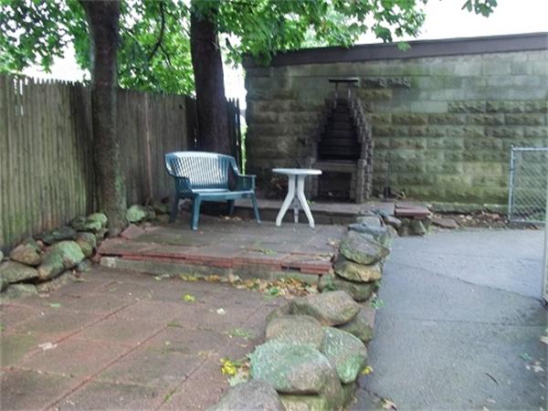 986 Middle Street Fall River, MA 02721 - Photo 4 of 11 a view of outdoor space with seating area and green space