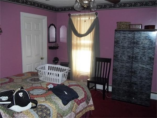 986 Middle Street Fall River, MA 02721 - Photo 8 of 11 a view of a balcony with chair and front door