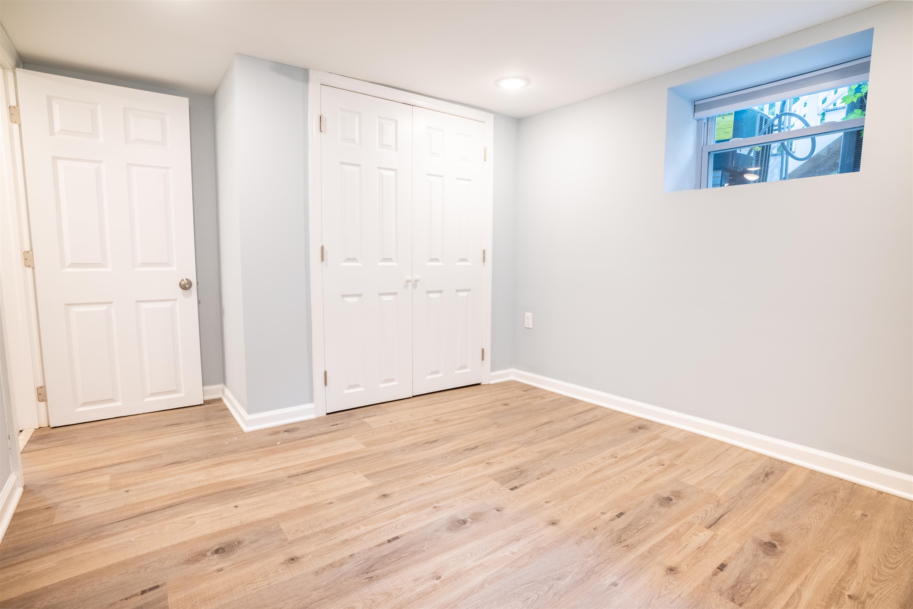 38 Mill Street, Unit 1 Bloomfield, NJ 07003 - Photo 11 of 20 an empty room with wooden floor and windows