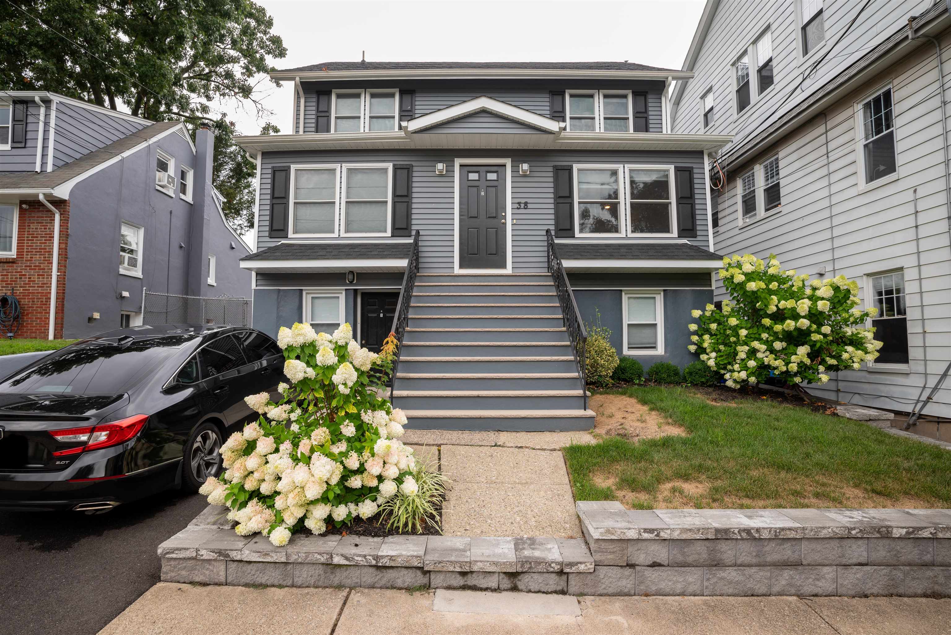 38 Mill Street, Unit 1 Bloomfield, NJ 07003 - Photo 19 of 20 a front view of a house with garden