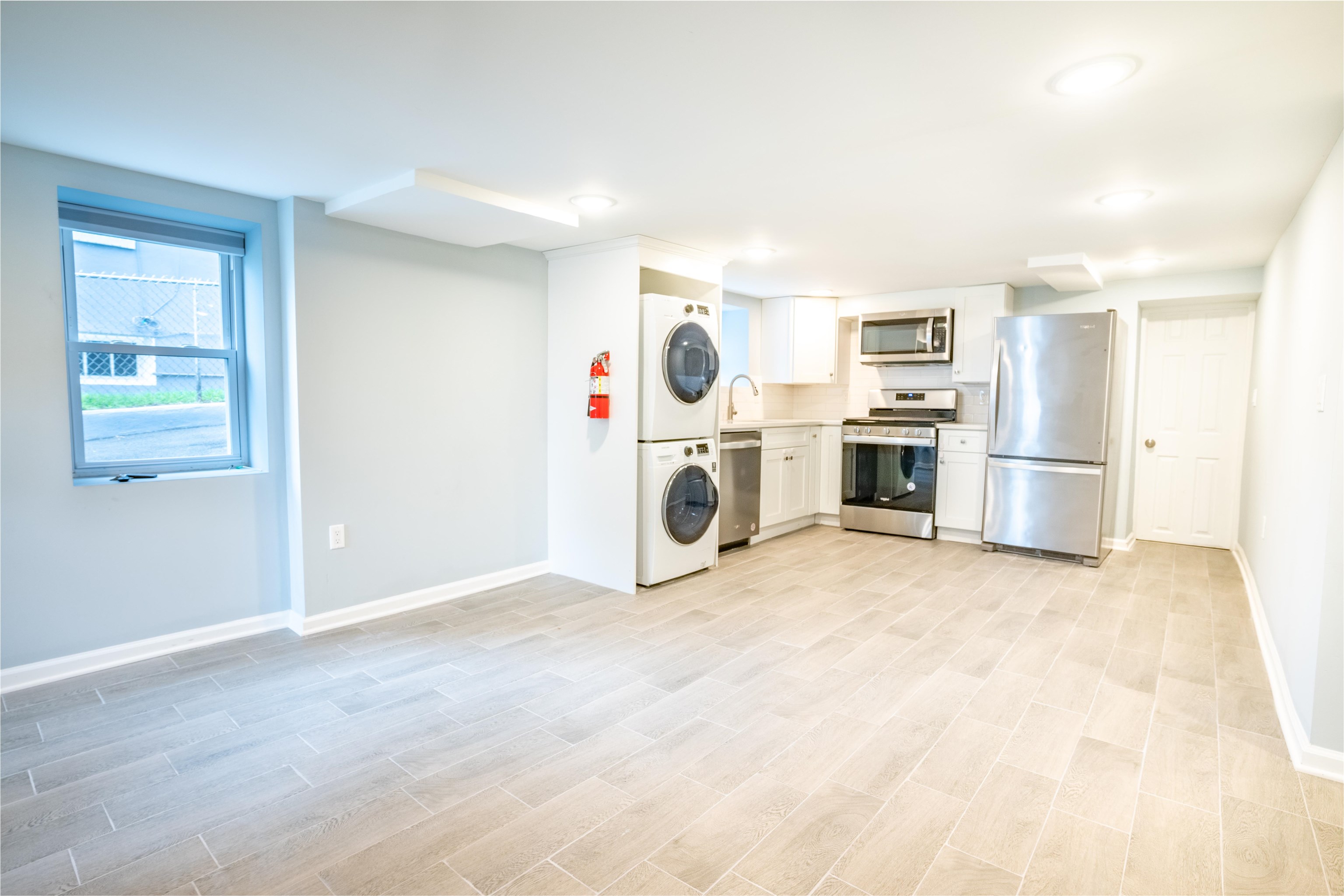 38 Mill Street, Unit 1 Bloomfield, NJ 07003 - Photo 2 of 20 a view of a kitchen with a sink stove cabinets and empty room
