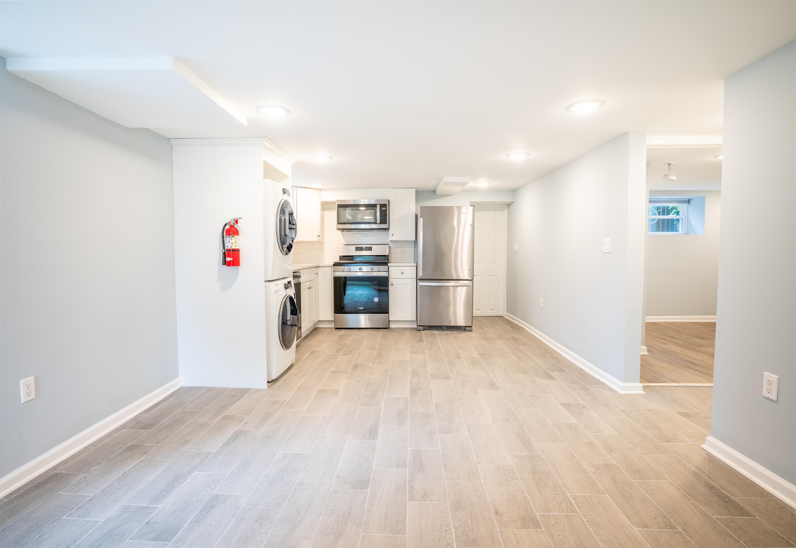 38 Mill Street, Unit 1 Bloomfield, NJ 07003 - Photo 3 of 20 a view of a kitchen with a stove cabinets and a wooden floor