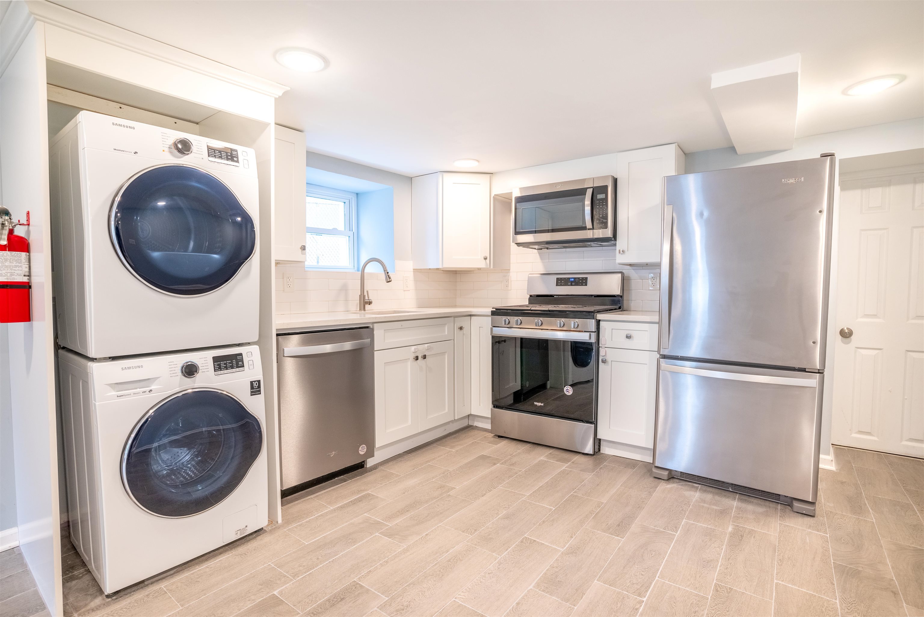 38 Mill Street, Unit 1 Bloomfield, NJ 07003 - Photo 6 of 20 a kitchen with a washer and dryer