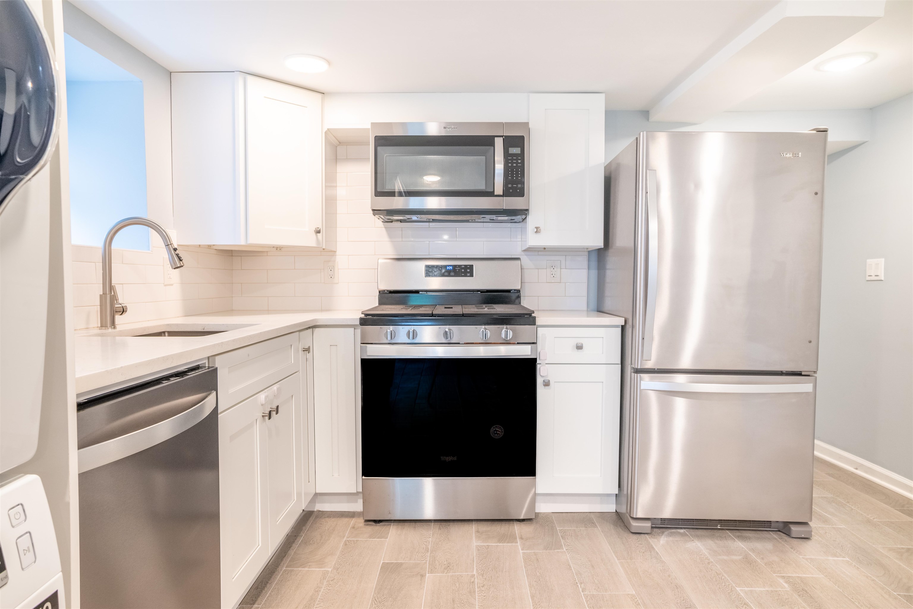 38 Mill Street, Unit 1 Bloomfield, NJ 07003 - Photo 9 of 20 a kitchen with stainless steel appliances a refrigerator stove and sink