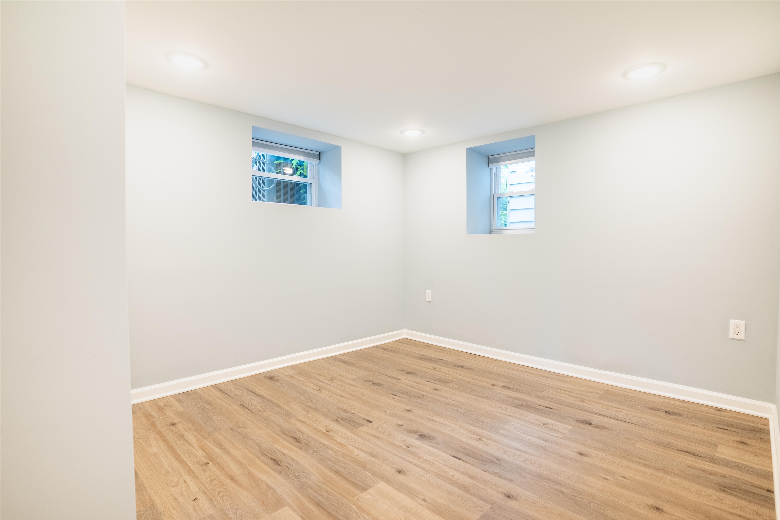 38 Mill Street, Unit 1 Bloomfield, NJ 07003 - Photo 10 of 20 a view of a room with wooden floor and white walls