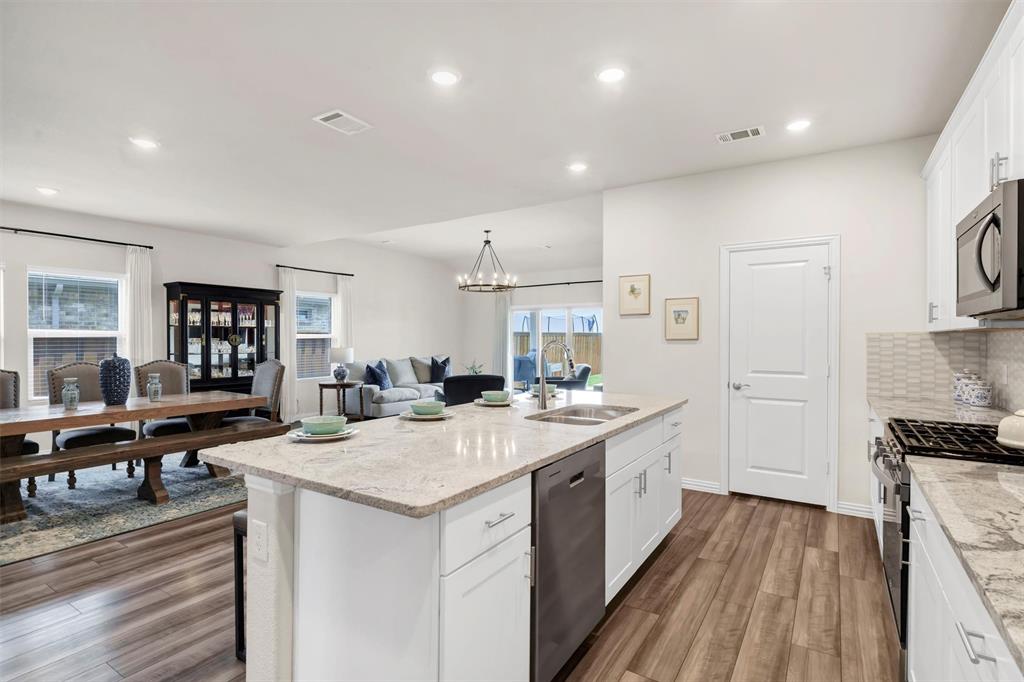 10616 Brookshire Road Fort Worth, TX 76126 - Photo 11 of 29 Thoughtfully designed open kitchen with a MASSIVE walkin pantry, gas stove and tons of cabinets
