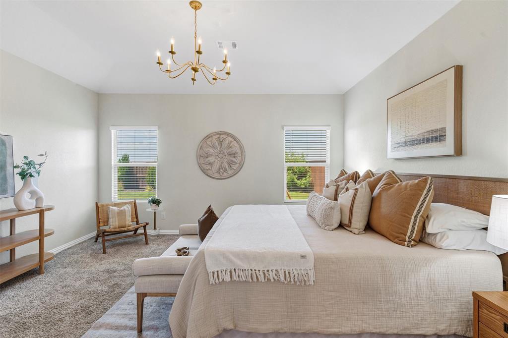 10616 Brookshire Road Fort Worth, TX 76126 - Photo 12 of 29 Private primary retreat on the 1st floor - gorgeous light fixture and great natural light overlooking the landscpaed backyard
