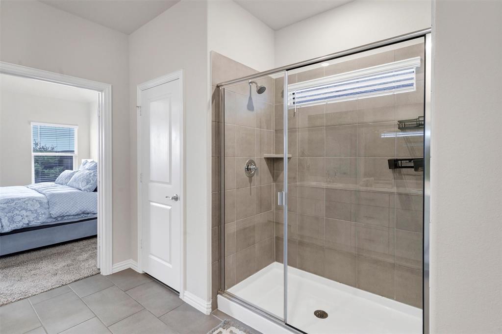 10616 Brookshire Road Fort Worth, TX 76126 - Photo 14 of 29 Large walk in shower next to a great linen closet with tons of storage