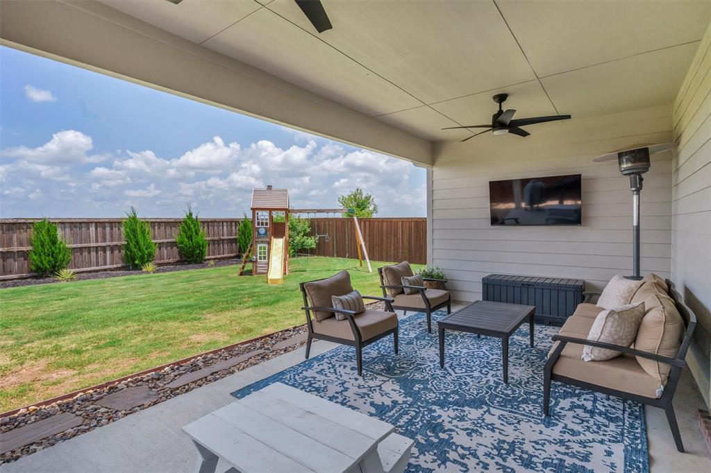 10616 Brookshire Road Fort Worth, TX 76126 - Photo 2 of 29 Extended back patio with 2 large fans, plus thoughtful landscape and drainage already installed so you can enjoy yourself year round