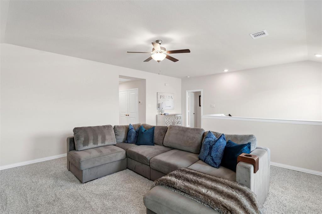 10616 Brookshire Road Fort Worth, TX 76126 - Photo 5 of 29 Great upstairs bonus living room - great for a large TV to watch game days or set up as a tucked away playroom for the kids