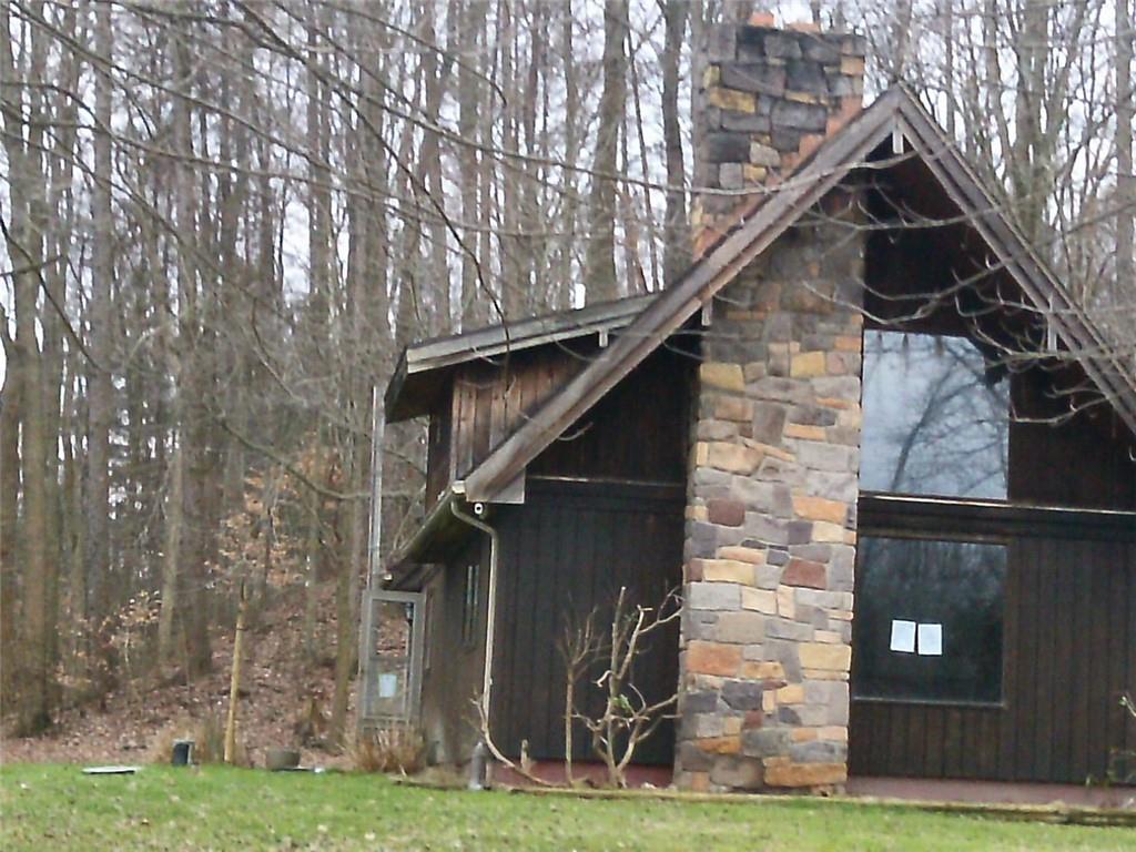 494 Gilmore Road New Castle, PA 16102 - Photo 2 of 7 a front view of a house with garden