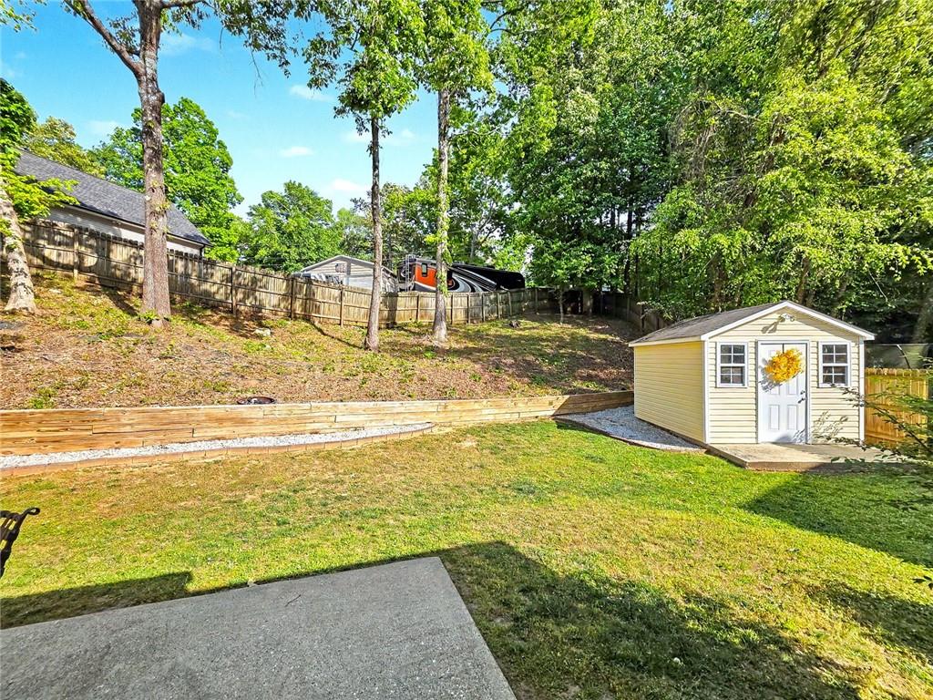 209 Diamond Valley Pass Canton, GA 30114 - Photo 23 of 27 a view of a house with pool and a yard