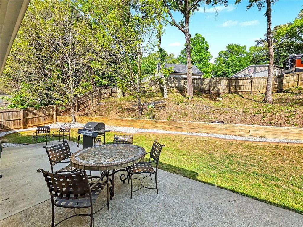 209 Diamond Valley Pass Canton, GA 30114 - Photo 24 of 27 a view of a swimming pool with a table and chairs
