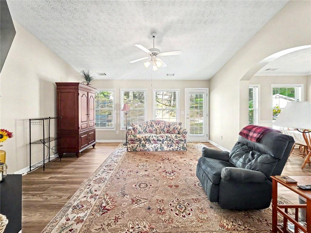 209 Diamond Valley Pass Canton, GA 30114 - Photo 5 of 27 a living room with furniture and a large window