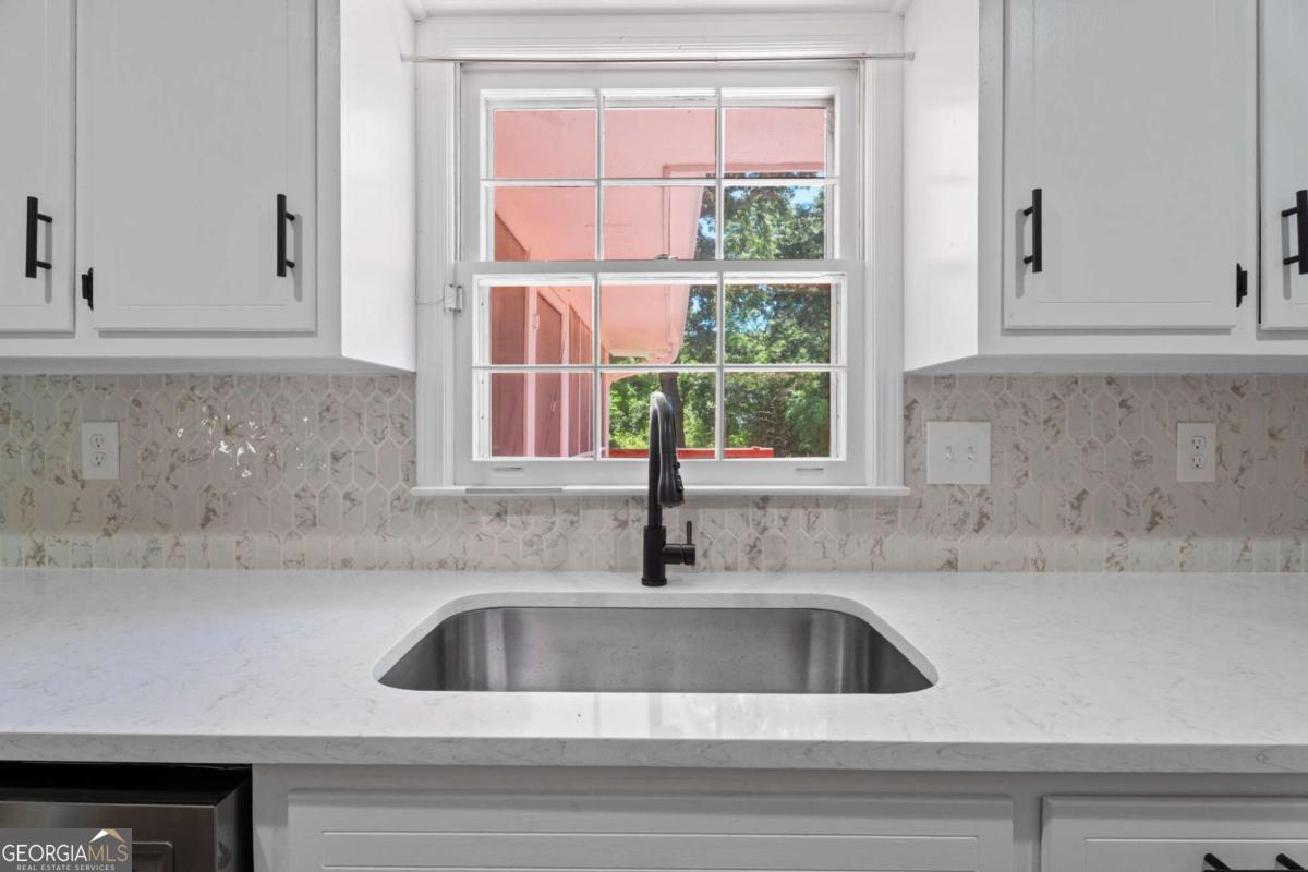 865 Old Tucker Road Stone Mountain, GA 30087 - Photo 17 of 57 a close view of sink and tap