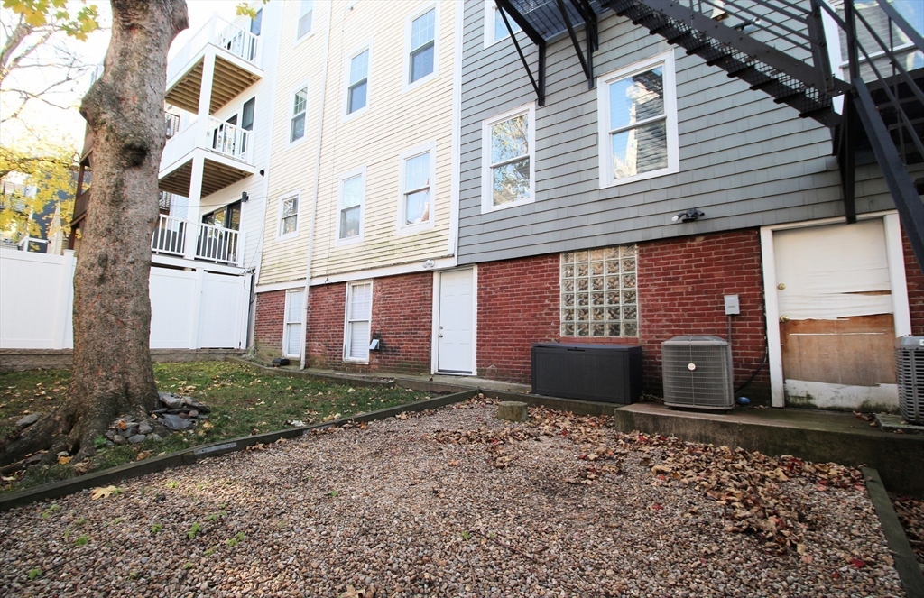 296 West 3rd Street, Unit U1 Boston, MA 02127 - Photo 14 of 22 a front view of a house with a yard