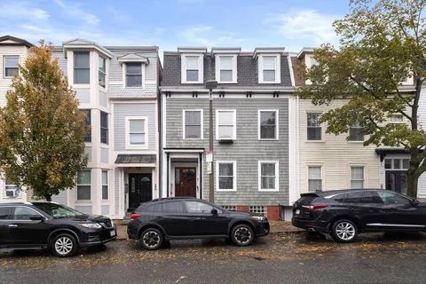 a car parked in front of a house