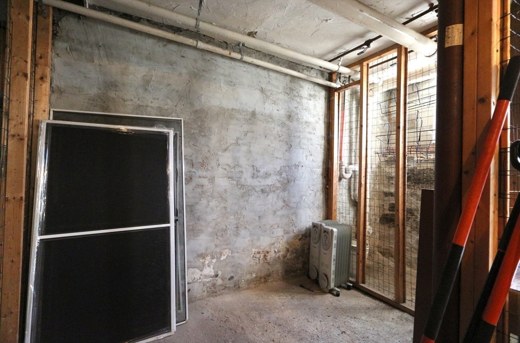 296 West 3rd Street, Unit U1 Boston, MA 02127 - Photo 22 of 22 a bathroom with a glass shower door