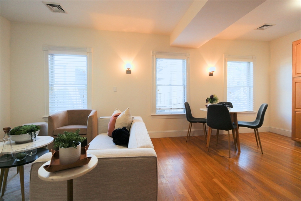 296 West 3rd Street, Unit U1 Boston, MA 02127 - Photo 6 of 22 a living room with furniture and a wooden floor