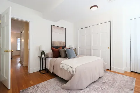 a bedroom with a bed and a table