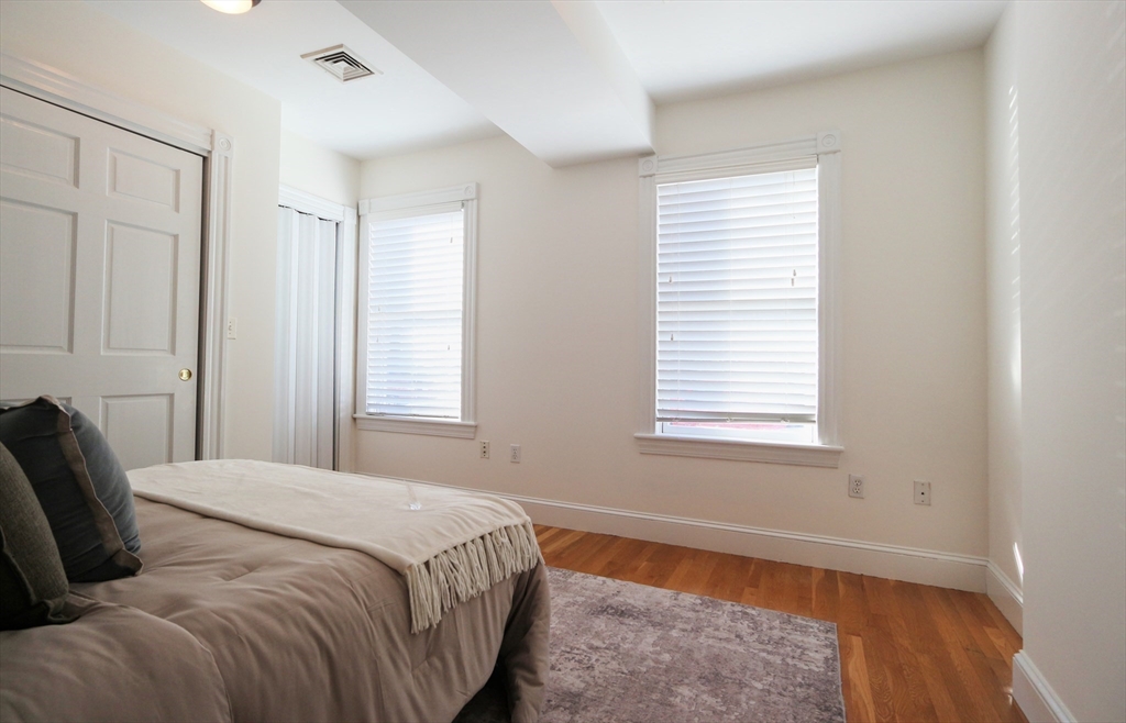 296 West 3rd Street, Unit U1 Boston, MA 02127 - Photo 10 of 22 a bedroom with a bed and a window
