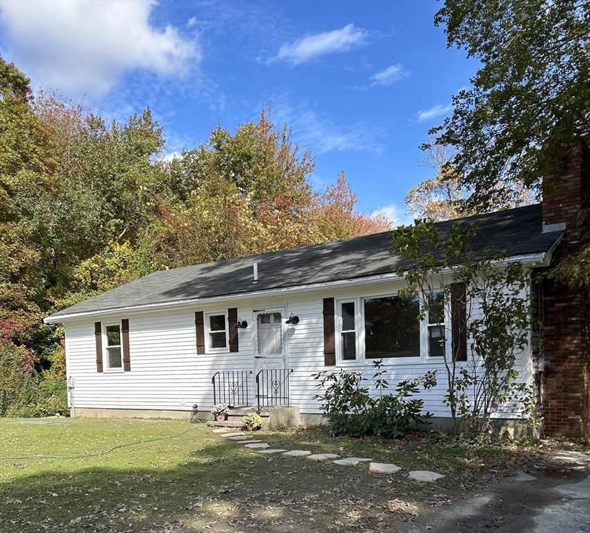 90 Merlin Drive Swansea, MA 02777 - Photo 1 of 13 front view of a house with a yard