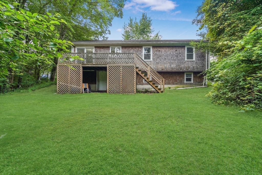 90 Merlin Drive Swansea, MA 02777 - Photo 12 of 13 a front view of house with yard and green space