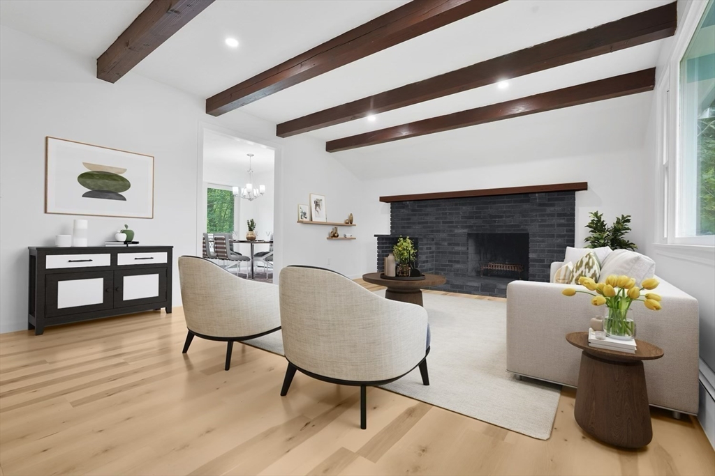 90 Merlin Drive Swansea, MA 02777 - Photo 4 of 13 a living room with furniture and a fireplace