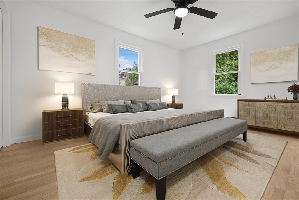 90 Merlin Drive Swansea, MA 02777 - Photo 6 of 13 a bedroom with a bed couch and window