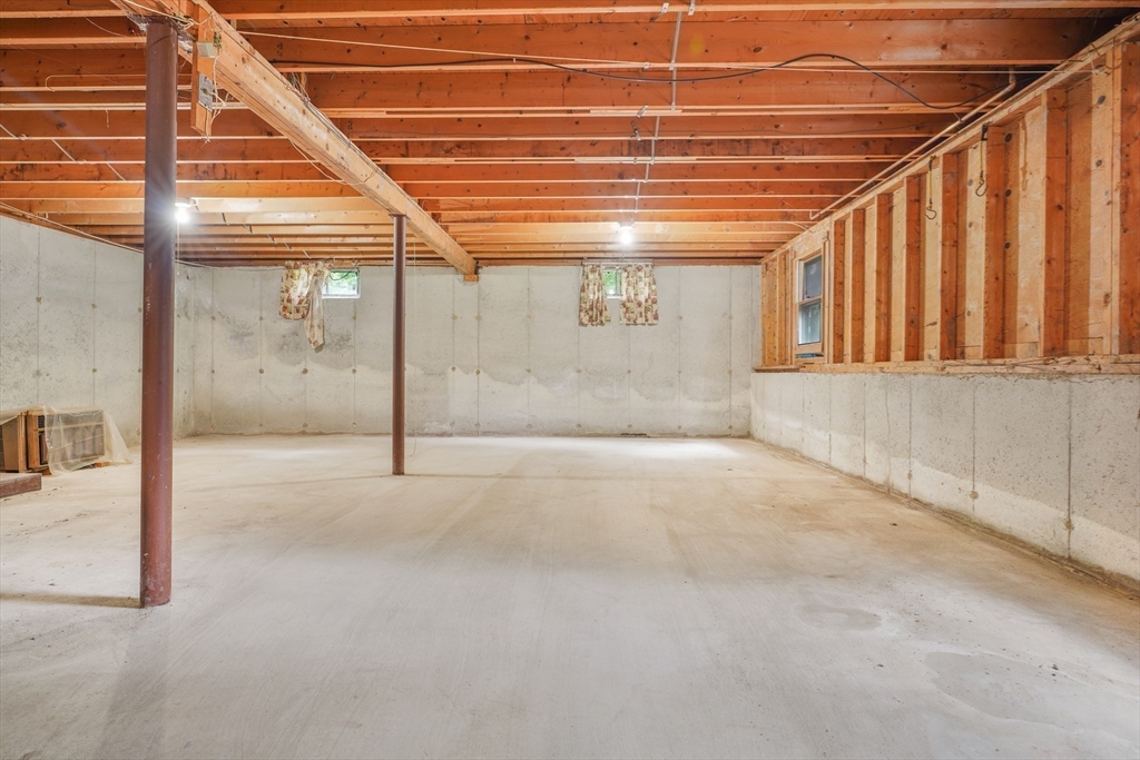 90 Merlin Drive Swansea, MA 02777 - Photo 9 of 13 a view of a room with wooden walls