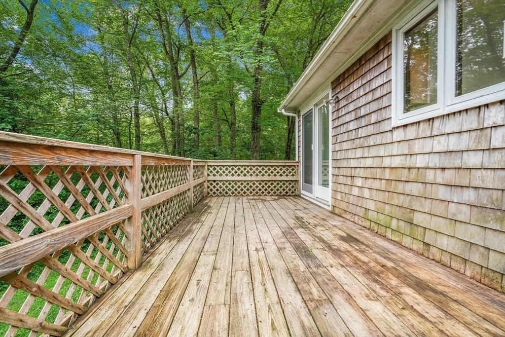 90 Merlin Drive Swansea, MA 02777 - Photo 10 of 13 a view of balcony with wooden floor and fence