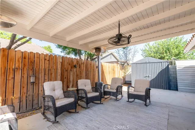 a view of patio with a table and chairs