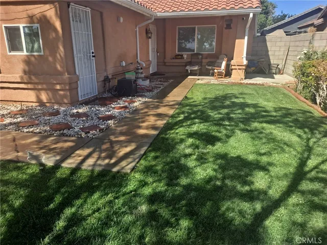 a view of a backyard of the house