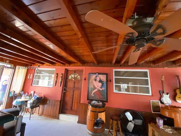 a front view of a house with outdoor seating