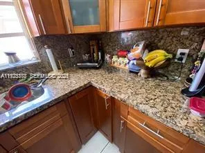 a kitchen with an oven a sink and a stove