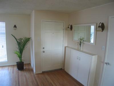4 Point San Pedro Road, Unit 6 San Rafael, CA 94901 - Photo 3 of 11 a view of an entryway with wooden floor and a potted plant