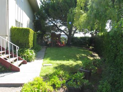 4 Point San Pedro Road, Unit 6 San Rafael, CA 94901 - Photo 9 of 11 a backyard of a house with lots of green space and garden