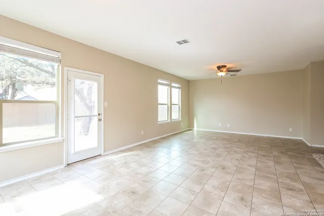 a view of an empty room with a window